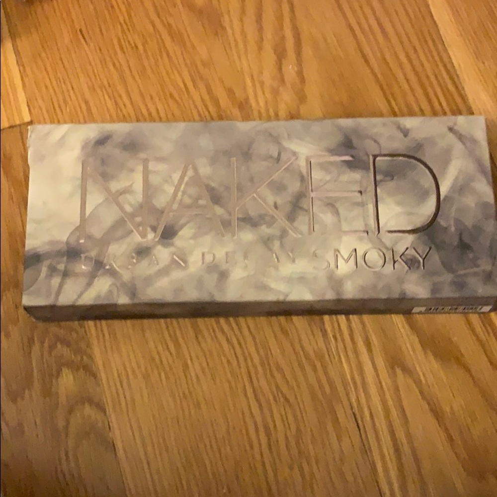 A eyeshadow palette with neutral to dark tones